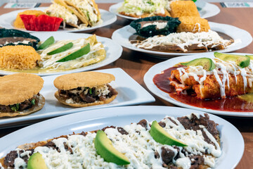 Buffet table of authentic Mexican food plates with several different flavors and styles to choose from.