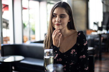 Beautiful young woman smile portrait at restaurant.