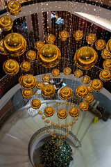 gold décor interior hanging over a christmas tree