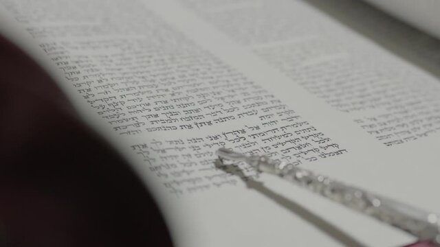 Reading a Torah scroll. Close-up
