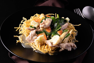 Close-up. Rad Na Noodles, crispy noodles with pork