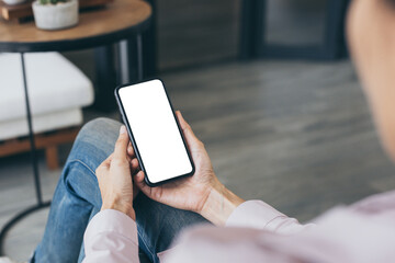 cell phone blank white screen mockup.woman hand holding texting using mobile on desk at office.background empty space for advertise.work people contact marketing business,technology