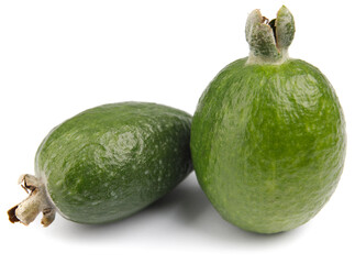 Two ripe feijoa fruits are isolated on a white background.