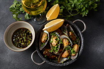 Classic French meal Moules marinière  Marinara mussels with garlic, sauce, lemon and parsley. 