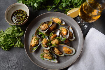 Classic French meal Moules marinière  Marinara mussels with garlic, sauce, lemon and parsley. 