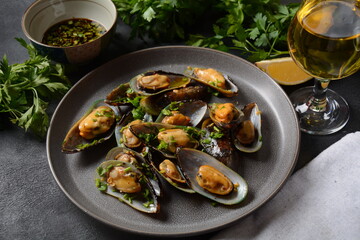 Classic French meal Moules marinière  Marinara mussels with garlic, sauce, lemon and parsley. 