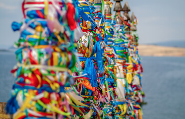 Colorful ribbons at Shamanka Mountain, Khuzhir village, Baikal lake, Russia