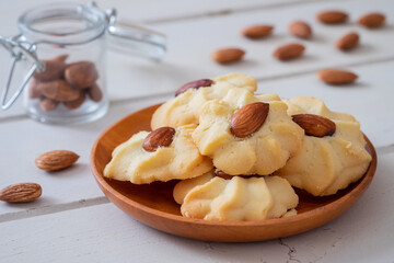 Almond cookies on wooden plate