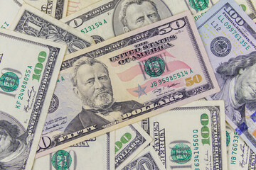 Fototapeta na wymiar Background of different us dollar banknotes