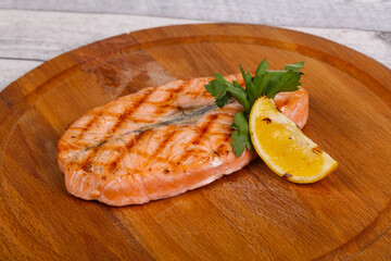 Grilled salmon served lemon and parsley