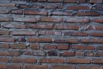 old red brick walls with a layer of cement and sand