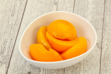 Marinated peaches fruit in the bowl