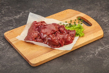 Raw chicken liver over board