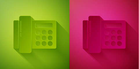 Paper cut Telephone icon isolated on green and pink background. Landline phone. Paper art style. Vector Illustration.