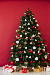 Christmas tree with gifts red decor new year interior