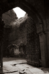 Fototapeta premium close view of Kalaburagi fort back entrance gate in monochrome stock photo