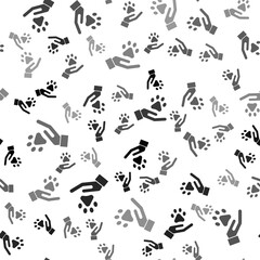Black Hands with animals footprint icon isolated seamless pattern on white background. Pet paw in heart. Love to the animals. Vector.