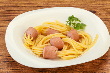 Kids pasta spaghetti with sausages