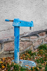 old blue street water pump