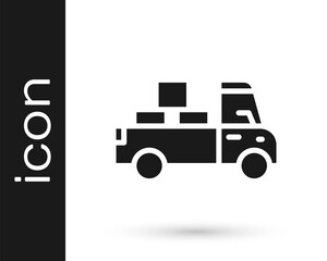Black Delivery truck with cardboard boxes behind icon isolated on white background. Vector.