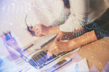 Multi exposure of woman hands typing on computer and financial chart hologram drawing. Stock market analysis concept.