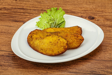 Baked potato with herbs and spices