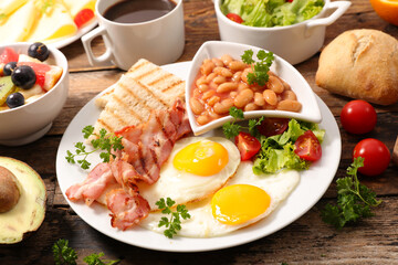 breakfast- toast, bean, fried egg and bacon