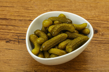 Pickled gherkin in the bowl