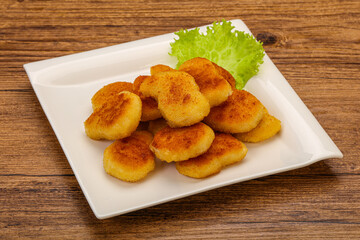 Fried chicken nuggets served salad leaves