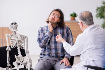 Young male patient visiting experienced doctor psychiatrist