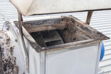 burnt-out insulation of the ventilation duct from the barbecue and the induction motor on the roof of the building