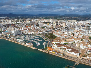 Aerial view of the city of Faro at the beautiful Algarve coast, in Portugal seen on a flight to Faro