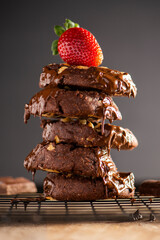 Stack of delicious chocolate cookies, food background.