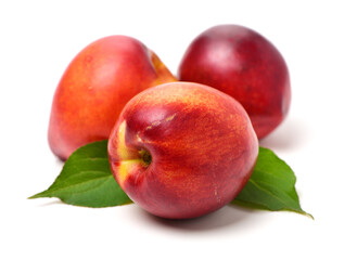 nectarines and leaf isolated on white background