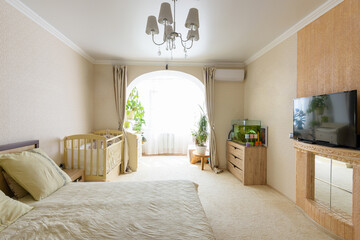 Interior of a spacious bedroom with access to a glazed loggia - obrazy, fototapety, plakaty