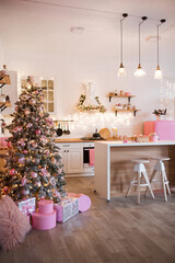 Modern Kitchen Interior with Island, Sink, Cabinets in New Luxury Home Decorated in Christmas Style.
