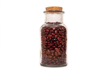 An isolated bottle of dried Kidney Beans on a white background, food preservation. Red Beans, nutritious healthy ingredient.