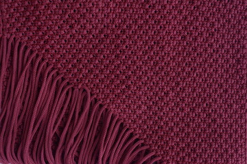 the texture of the knitted fabric is dark red