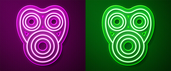Glowing neon line Gas mask icon isolated on purple and green background. Respirator sign. Vector.