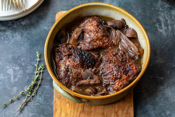 Cock au vin, French dish of chicken braised in wine