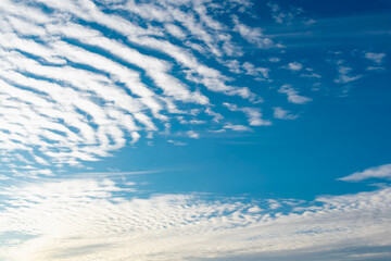 simple blue sky with white clouds in the cool season, freshness and a clear Sunny day in nature
