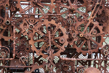 Rusty iron mechanical parts and gear wheels. Steampunk texture