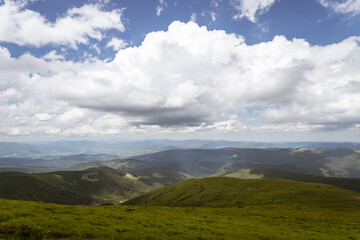 Fototapeta na wymiar Beautiful mountain landscape with beautiful clouds. The Carpathians.
