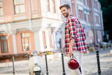 Man going to ride his retro scooter