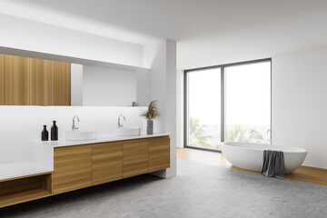 Wooden and white bathroom corner with tub and sink