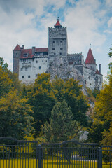 Fototapeta na wymiar Frog view of Bran castle or famous Dracula's castle, close to Bran, Romania on a cloudy summer day.