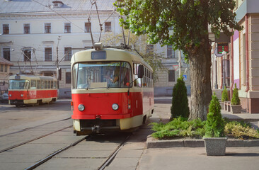 Fototapeta na wymiar Electric tram vehicle. Urban rail transport. Environmental-friendly transportation. Kyiv. Ukraine. More than 125 years tram vehicles have been used in the city 