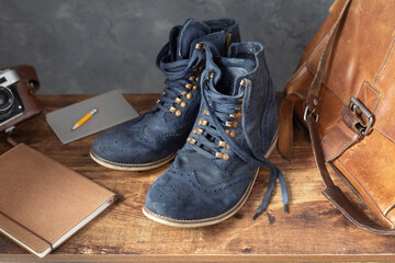 travel vintage old boots shoes at wooden desk table