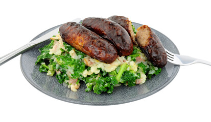 Traditional Irish Colcannon and sausage meal, Colcannon is made with mashed potato and kale or cabbage, isolated on a white background