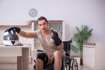 Fototapeta na wymiar Young male motor-cyclist suffering at home after accident
